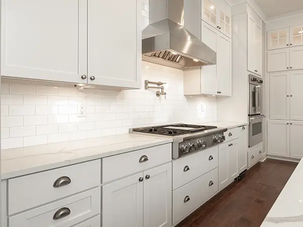 white kitchen interior with stainless steel appliances