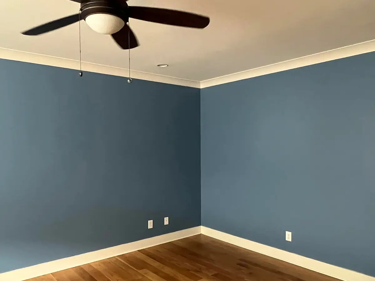 interior painting project of a room painted blue with white ceiling