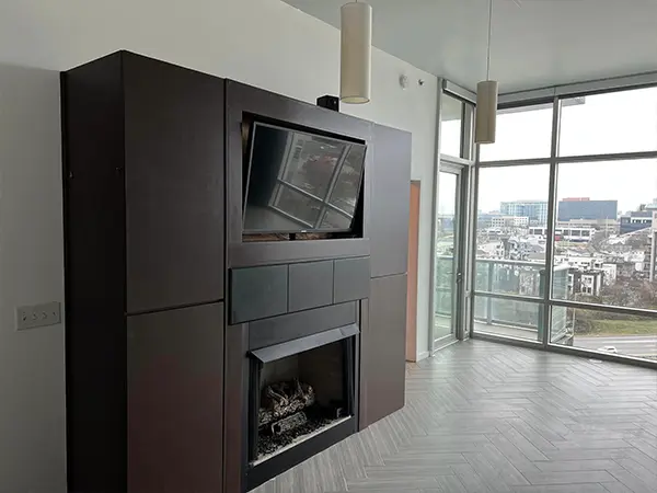 dark brown fireplace and built-in TV