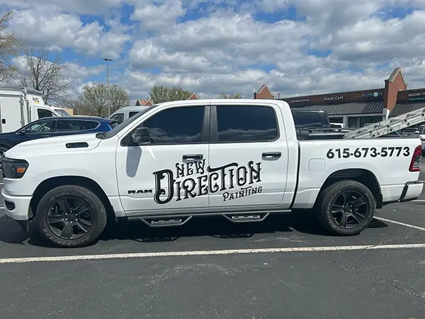 white pickup truck with new direction painting wrap