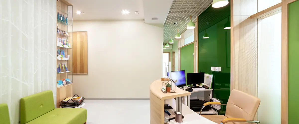 Modern office reception area with clean green and white wall finishes