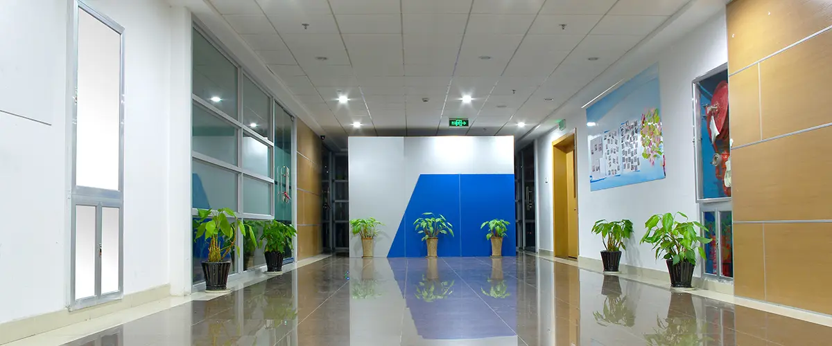 Clean commercial hallway with potted plants