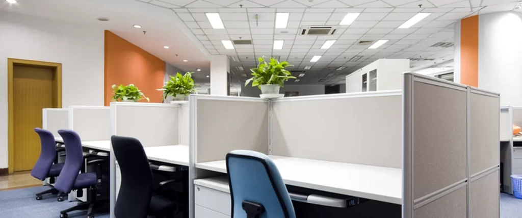 commercial painting modern office interior with blue carpet cubicles ergonomic chairs and plants
