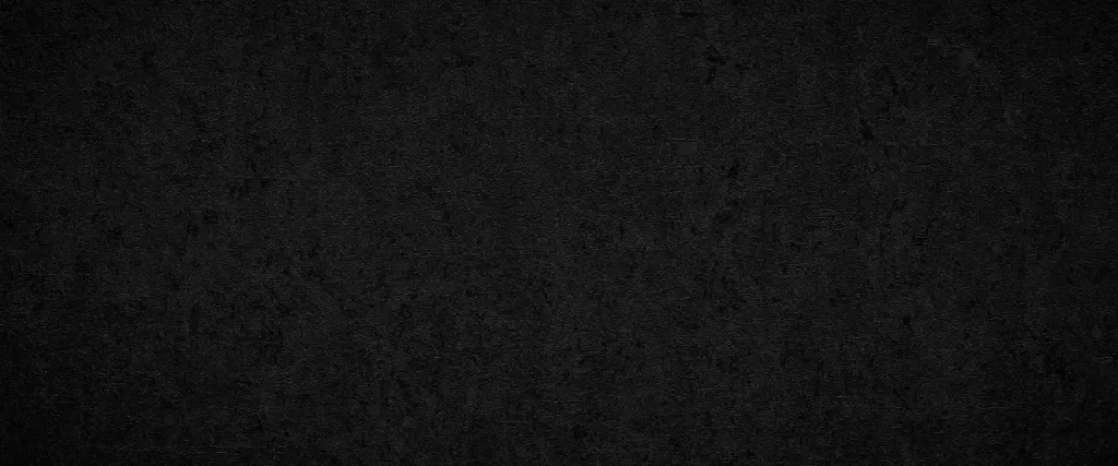 a dark, textured off black wall