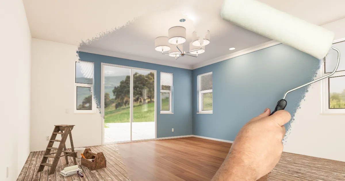 a room being renovated with a fresh coat of blue paint applied to an accent wall and a white ceiling