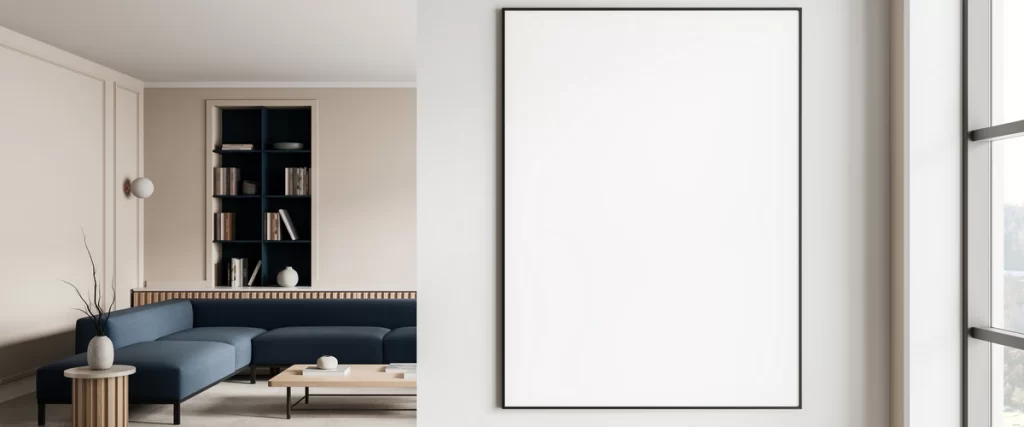 A minimalist interior with beige walls, a navy blue sectional sofa, and a large vertical blank picture frame ready for art.