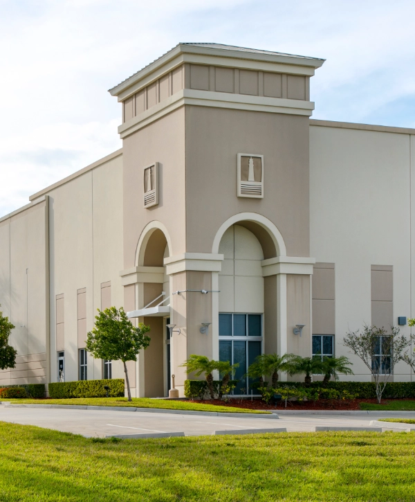 Front image of a commercial building painted in beige color
